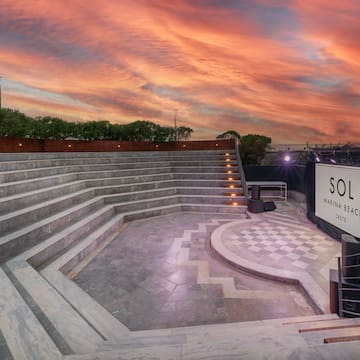 a large outdoor stage with a sign