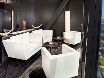 a room with white furniture and black walls