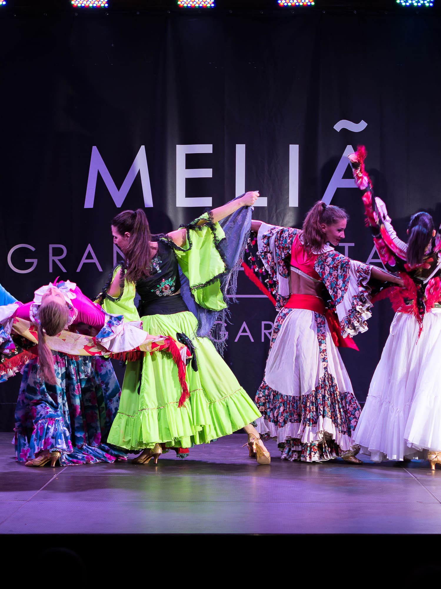 a group of women dancing on a stage