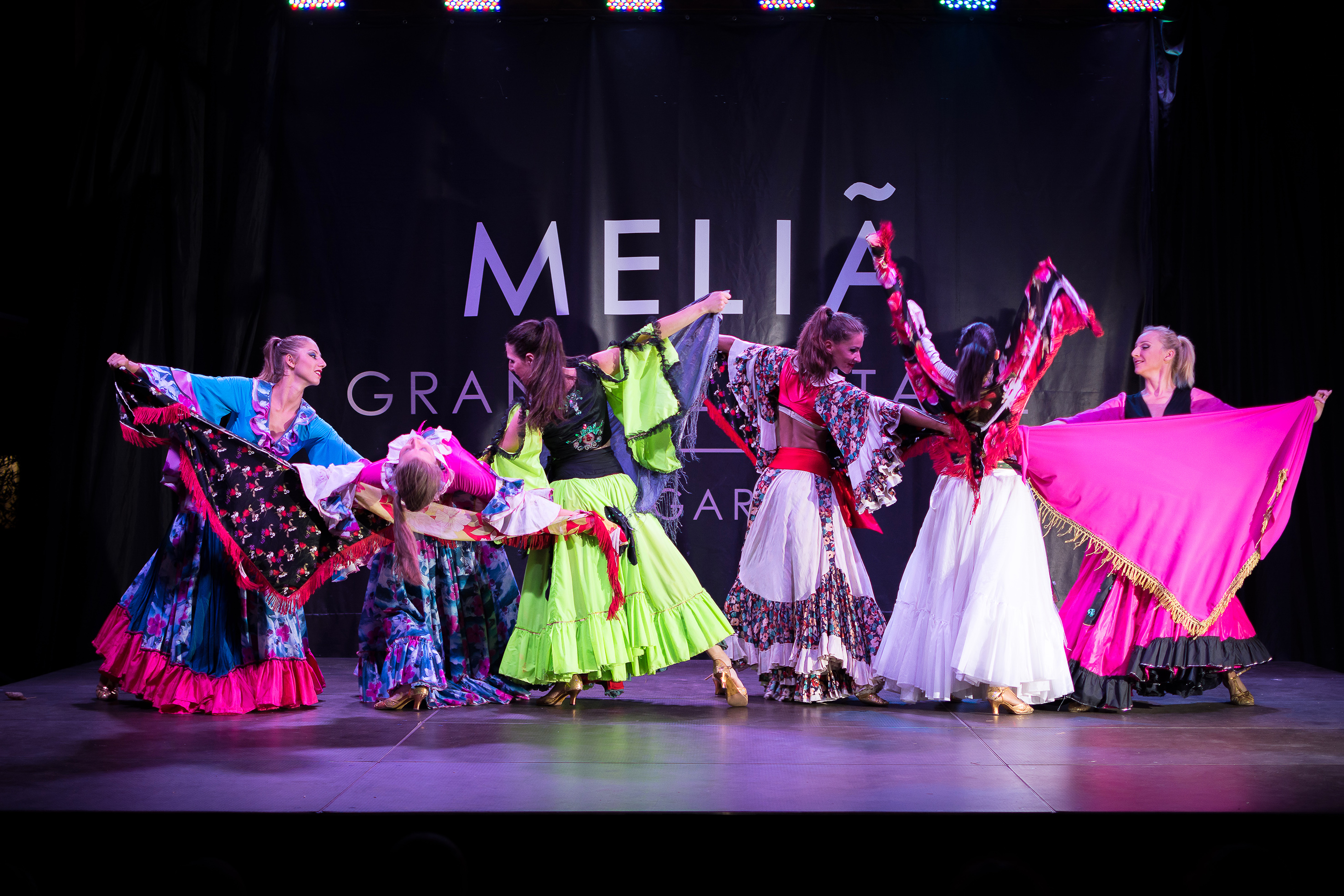 a group of women dancing on a stage