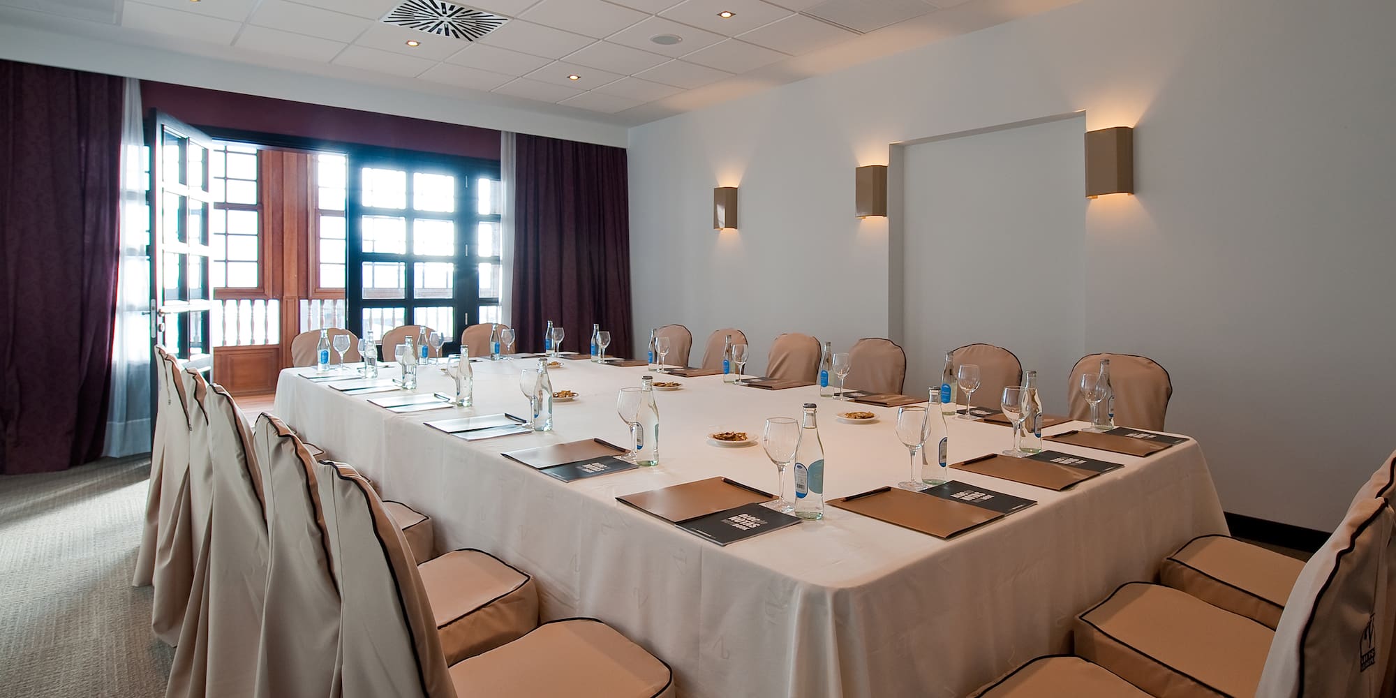 a large conference room with a table set up