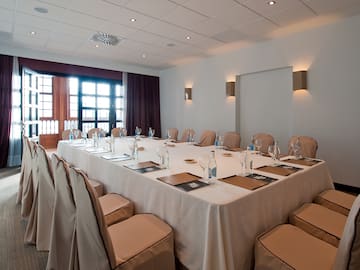 a large conference room with a table set up