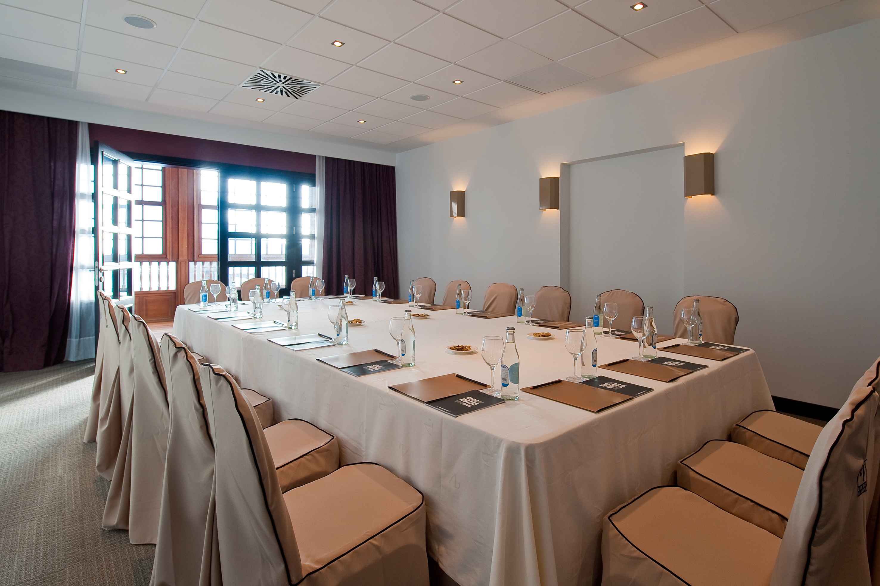 a large conference room with a table set up