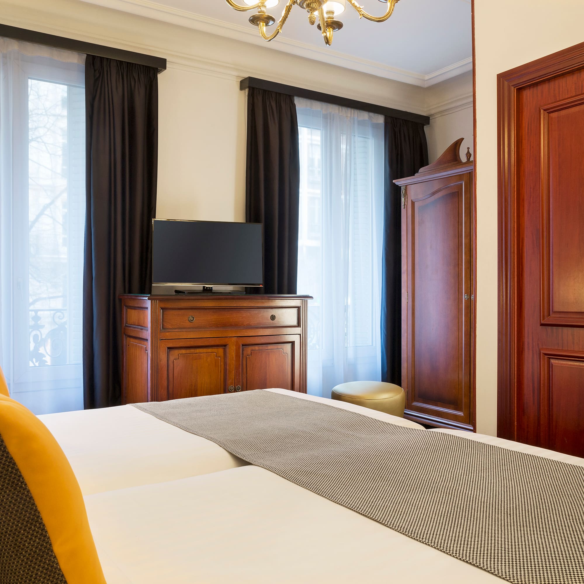 a room with a bed and a dresser