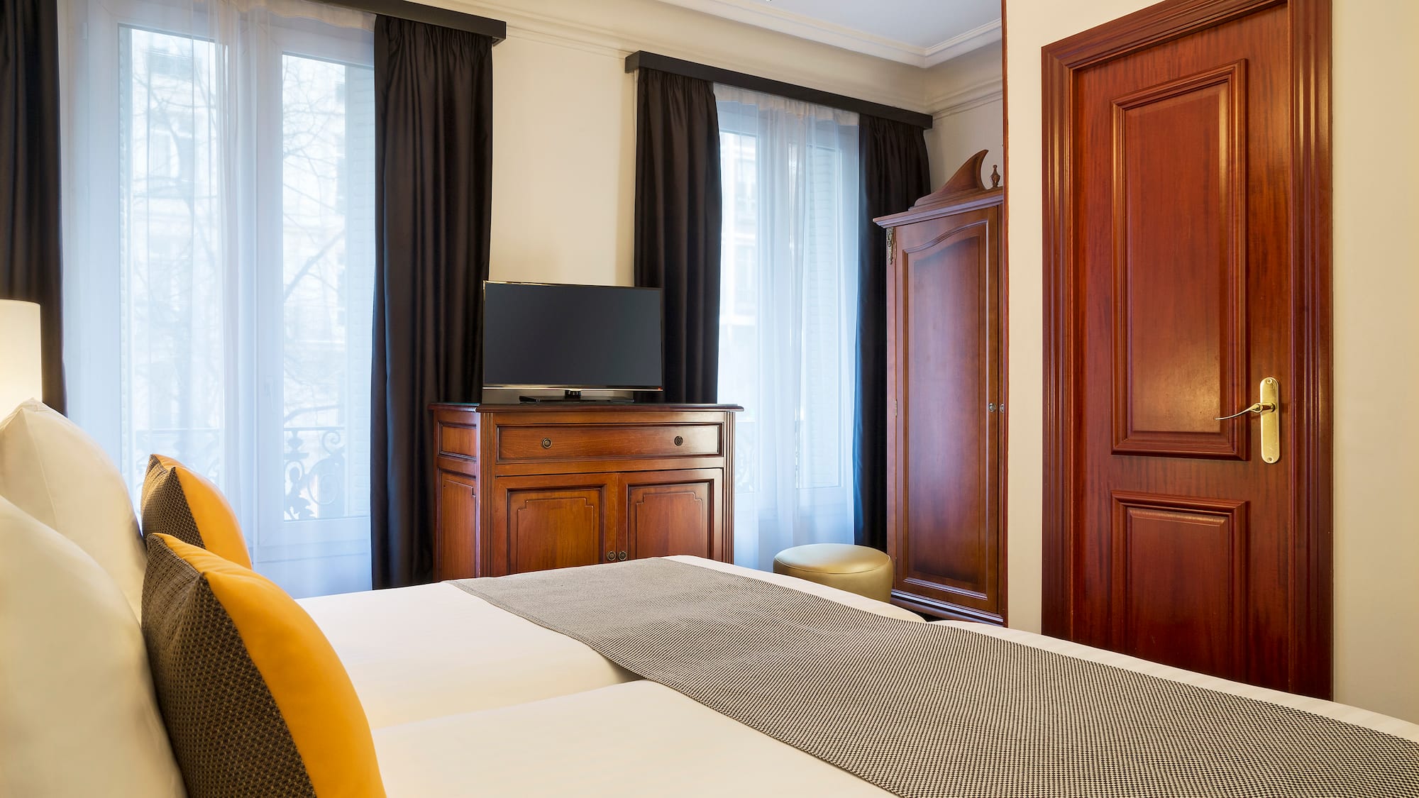 a room with a bed and a dresser