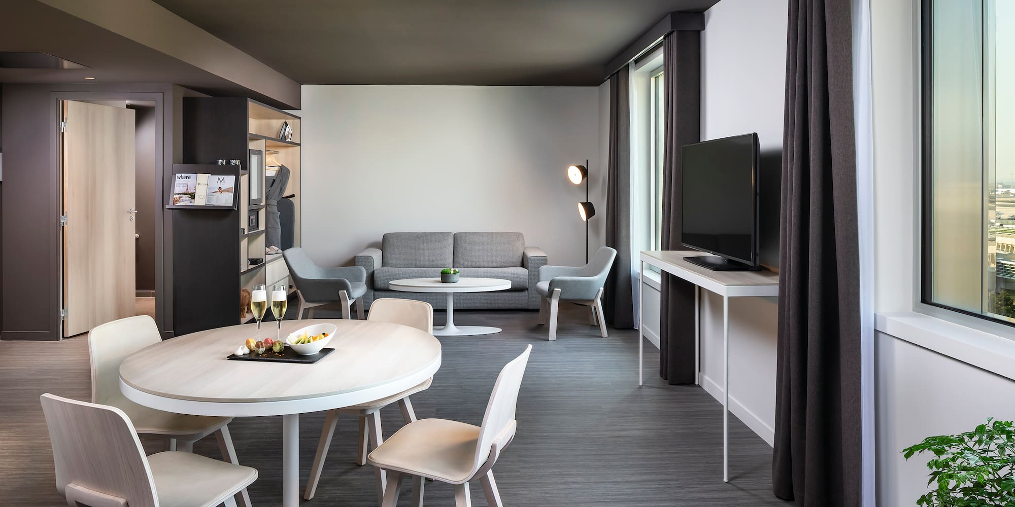 a room with a television and a table