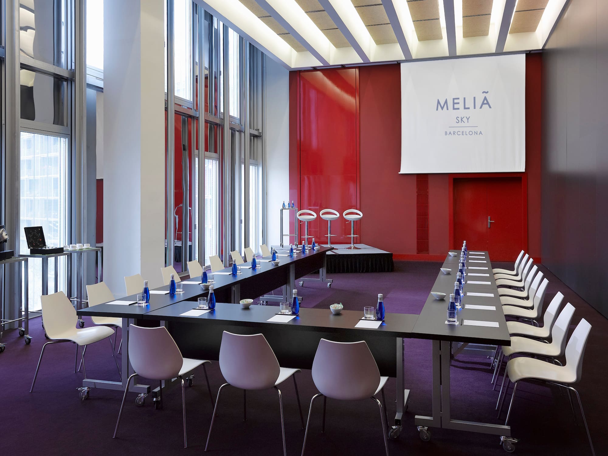 a conference room with tables and chairs