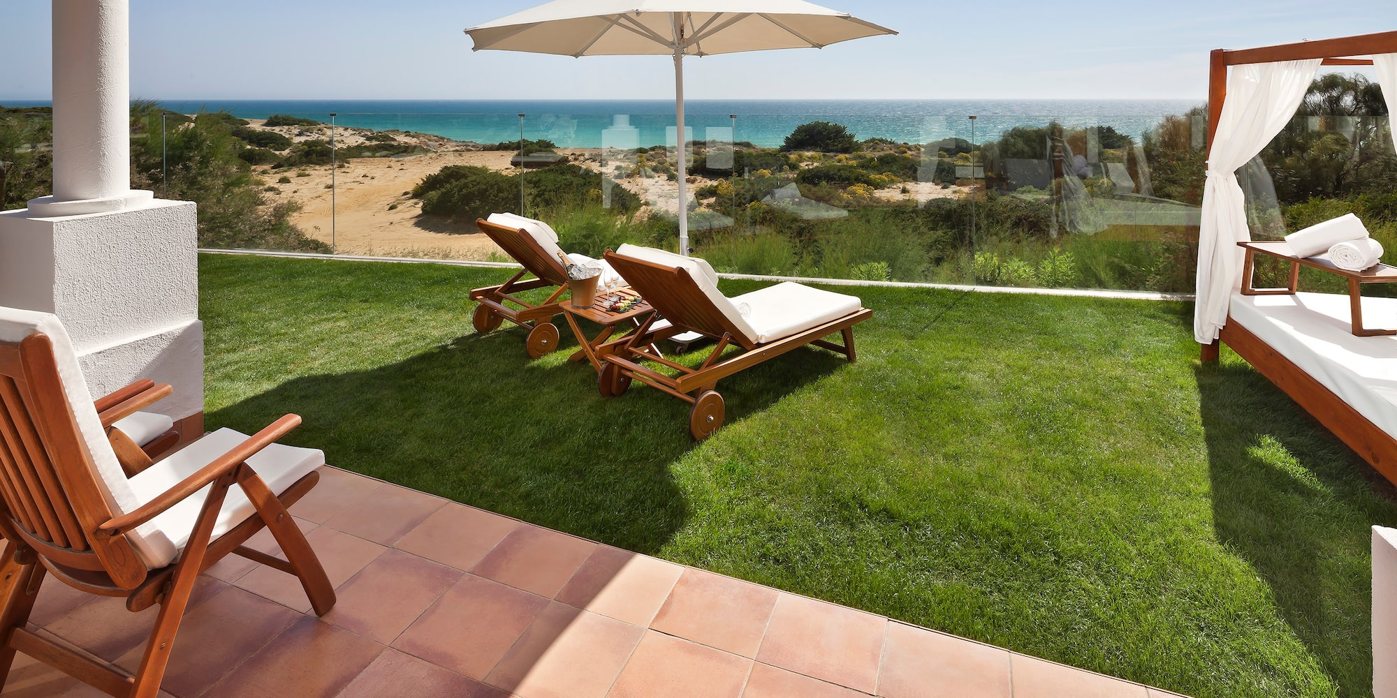 chairs and umbrella on a lawn