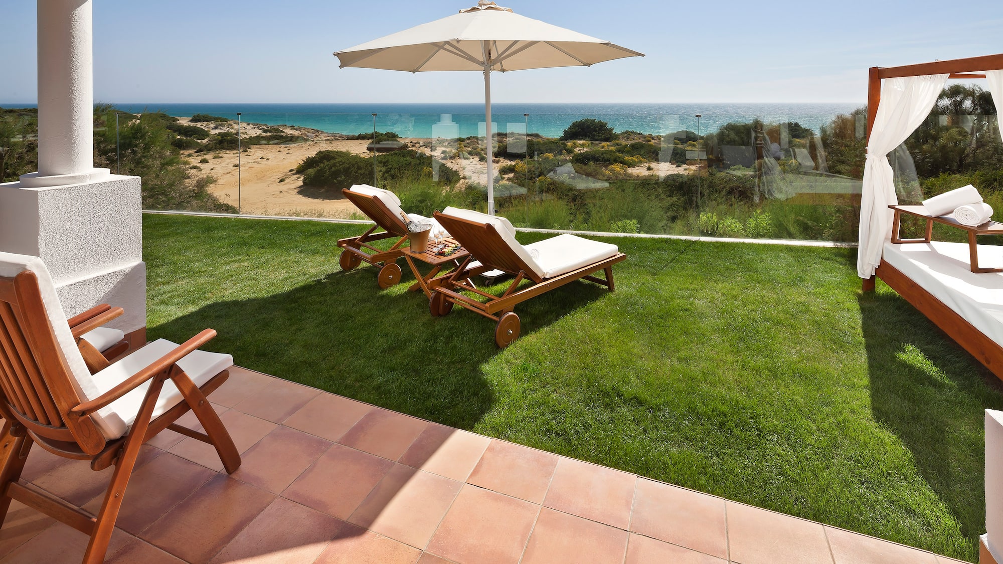 chairs and umbrella on a lawn