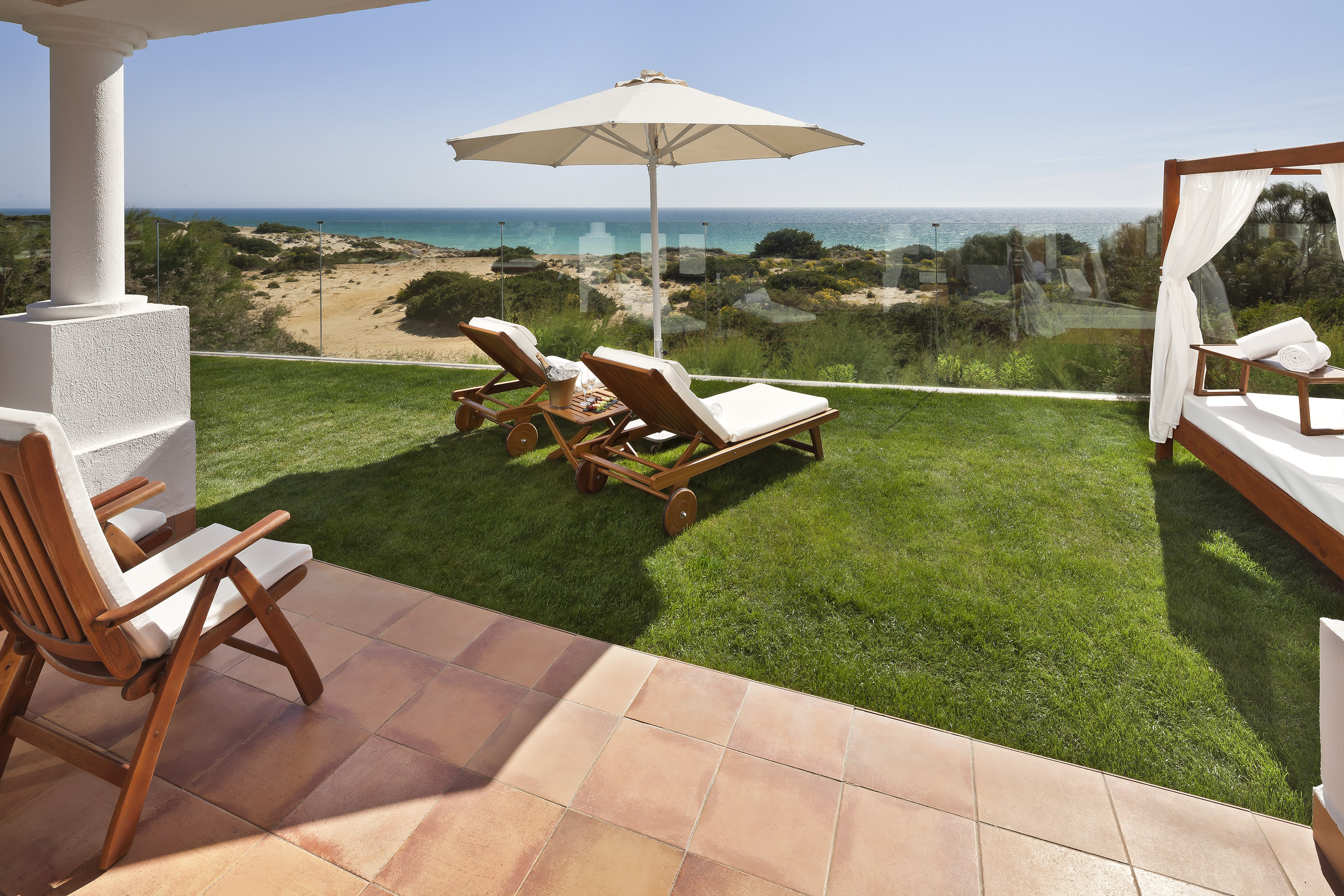 chairs and umbrella on a lawn