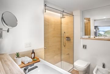 a bathroom with a glass shower door