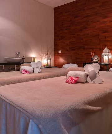 a massage room with towels and towels