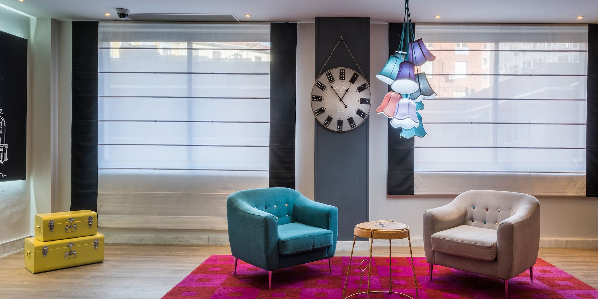 a room with chairs and a clock