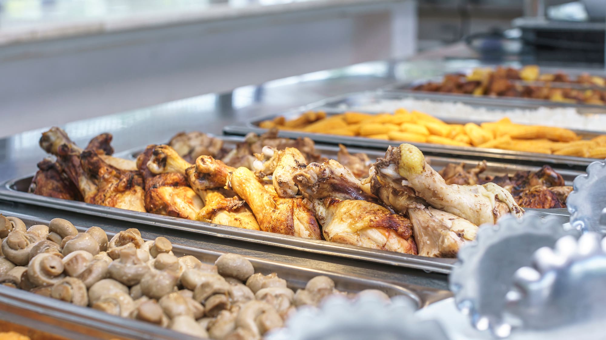 a trays of food on a counter