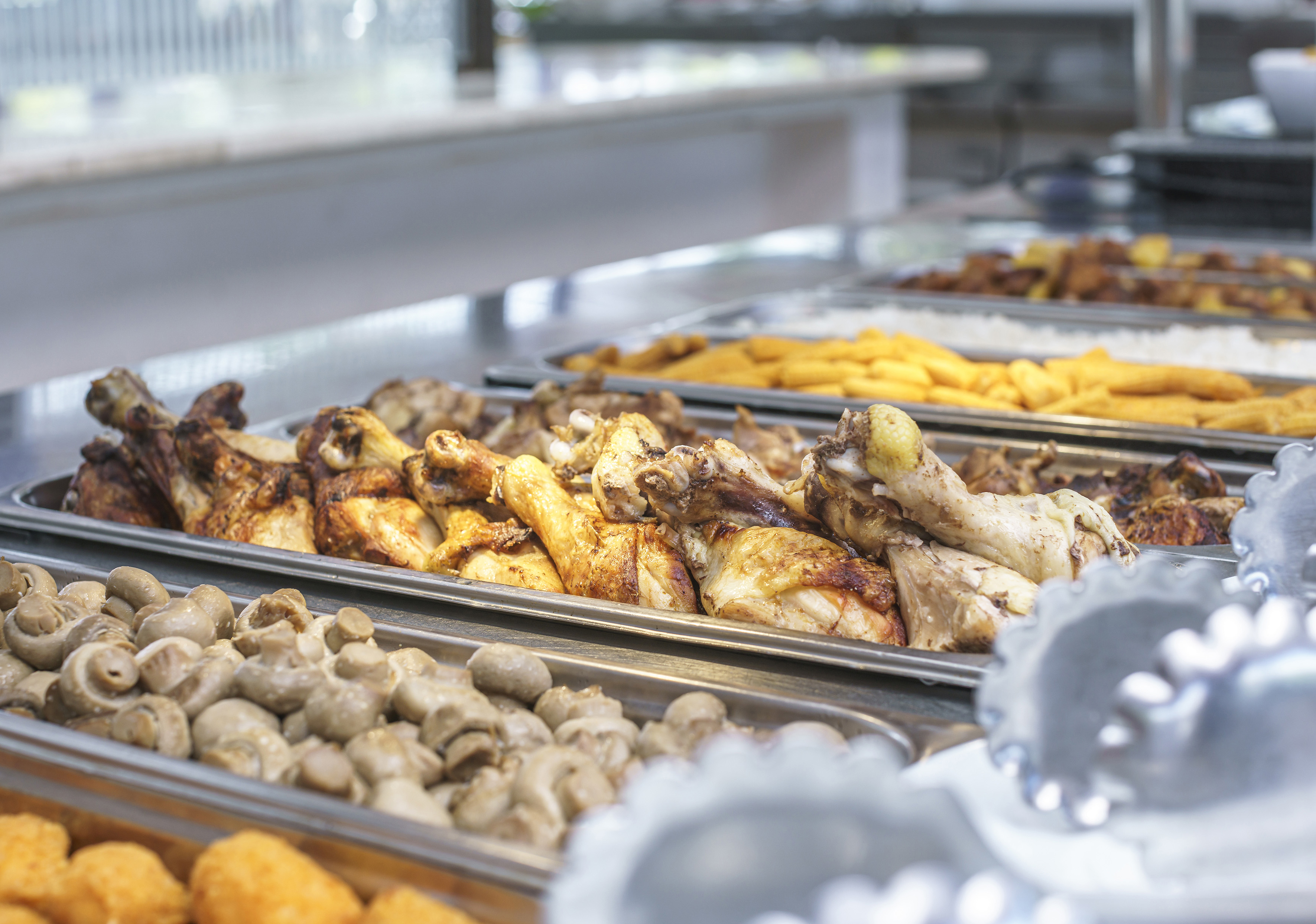 a trays of food on a counter