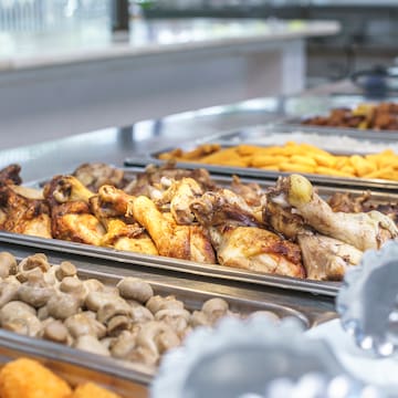 a trays of food on a counter