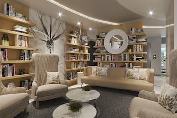 a room with a couch and bookshelf