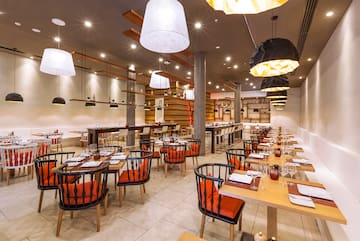 a restaurant with tables and chairs