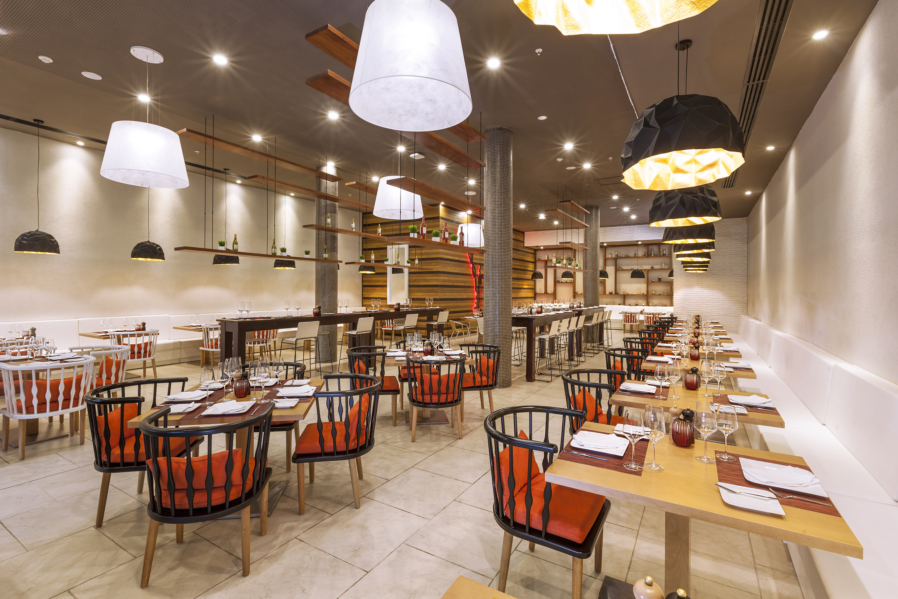 a restaurant with tables and chairs