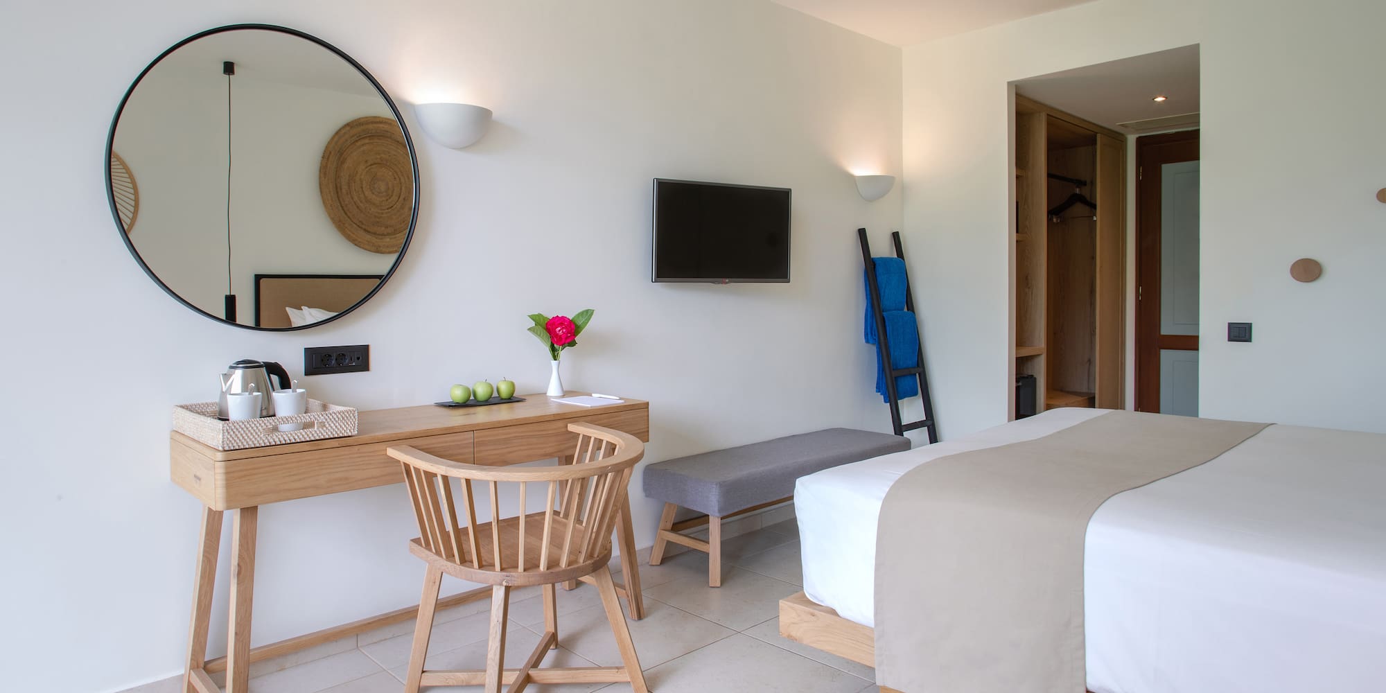 a room with a bed and a desk