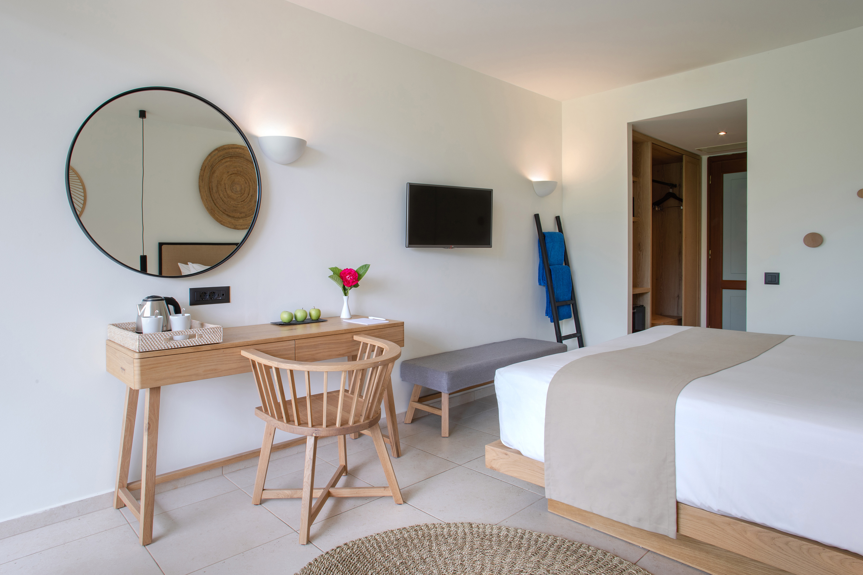 a room with a bed and a desk