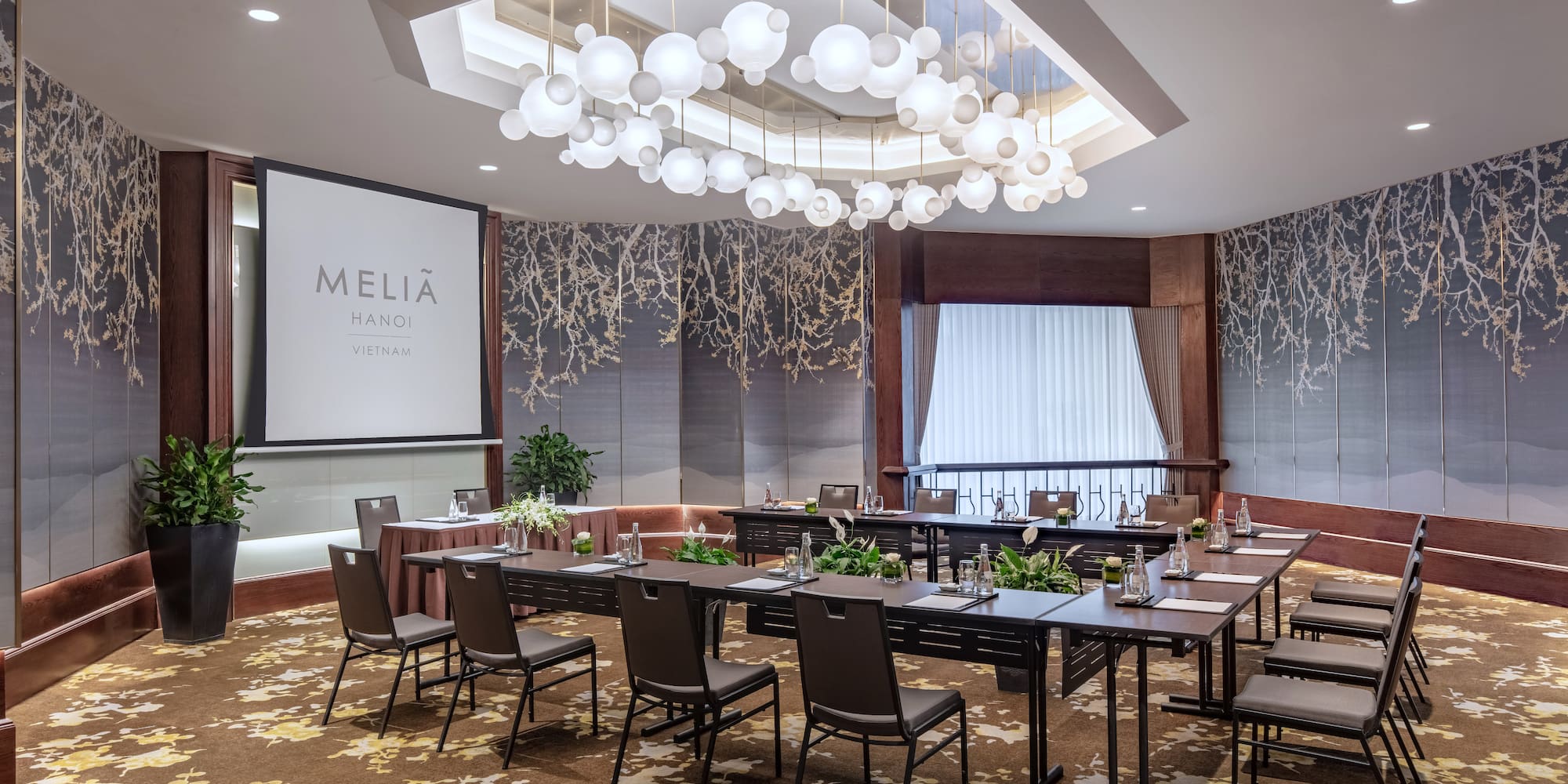 a room with a large table and chairs