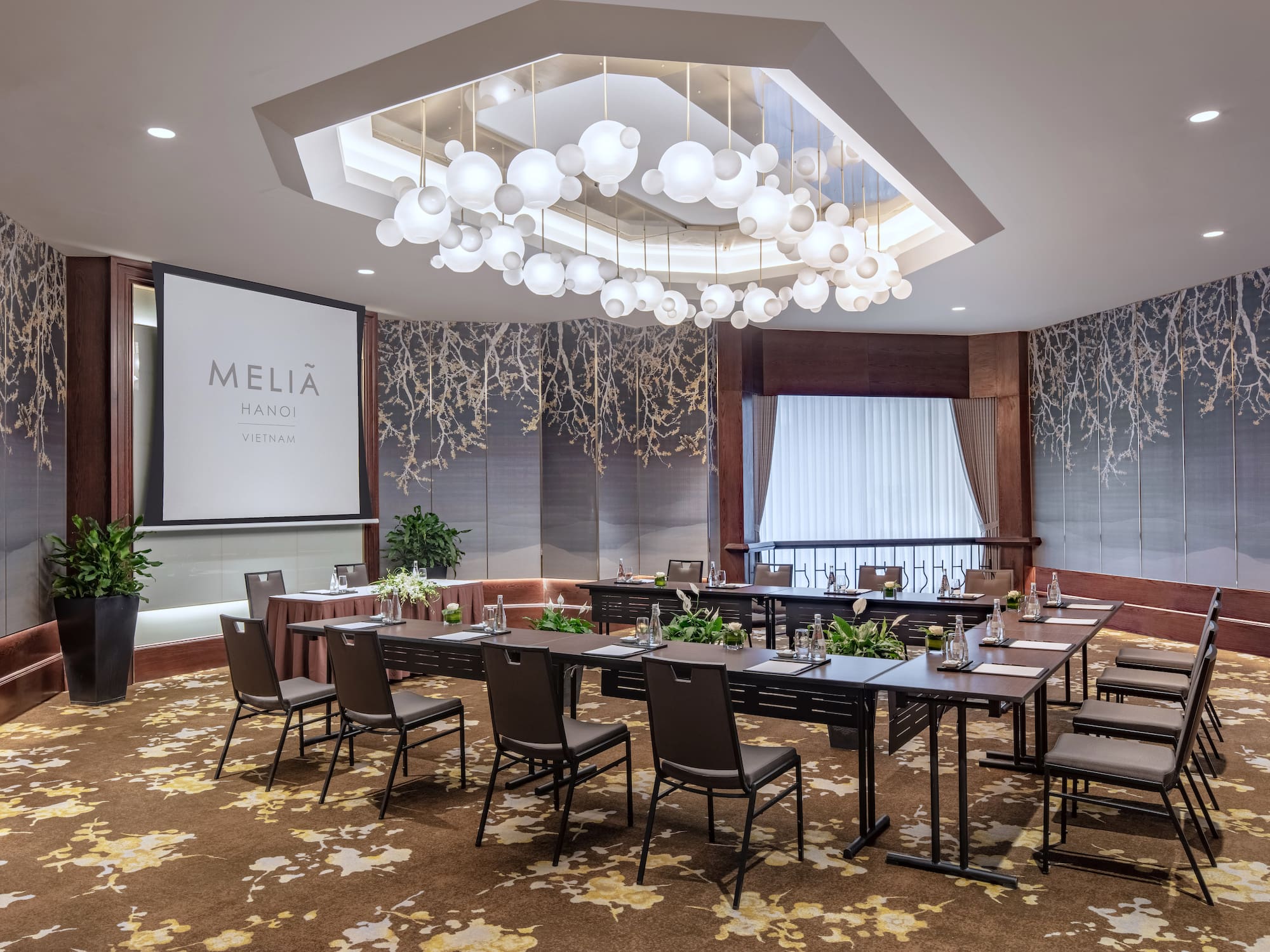 a room with a large table and chairs