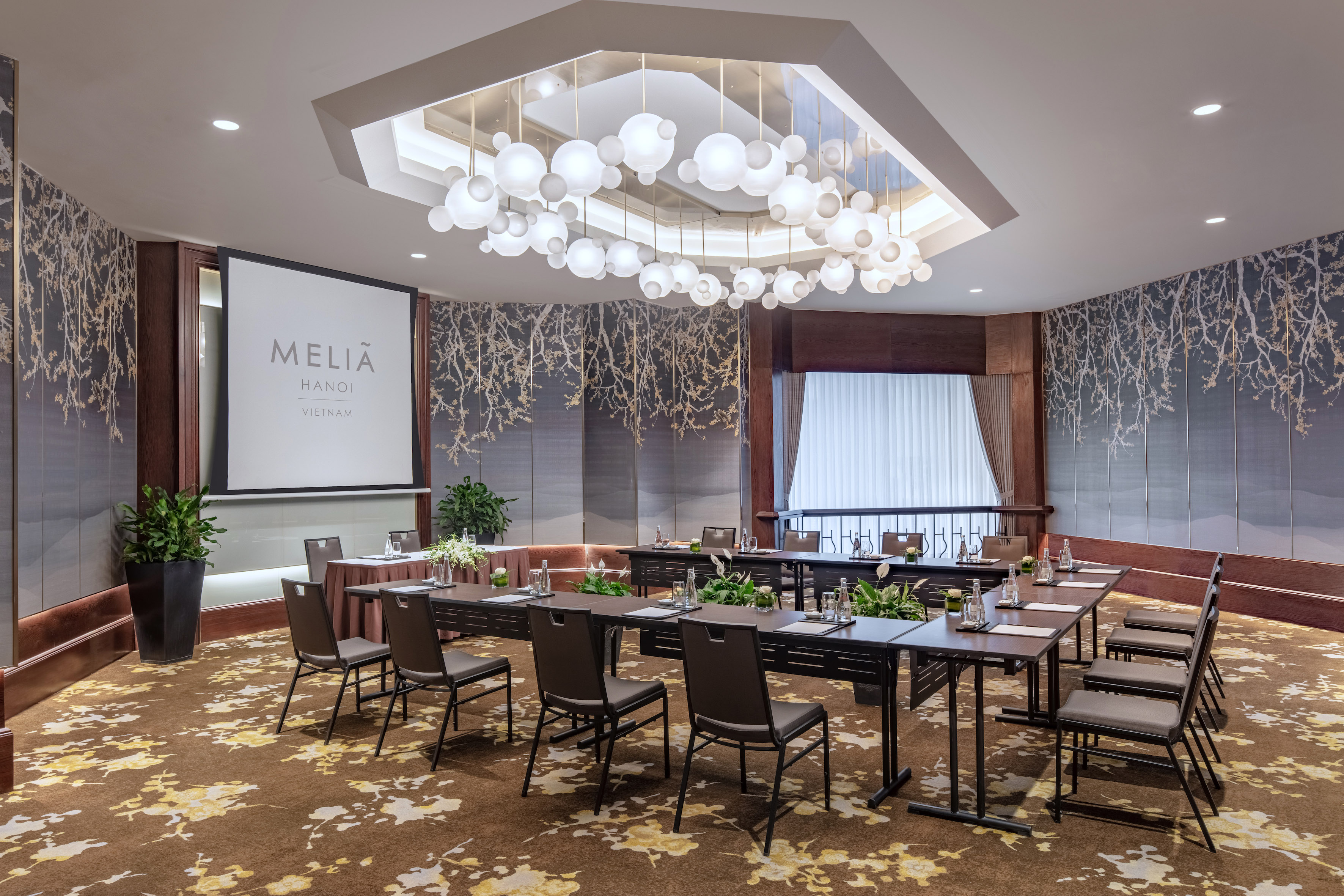 a room with a large table and chairs