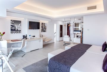 a room with two beds and a tv