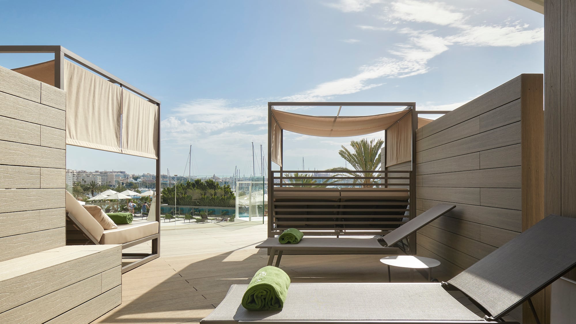 a deck with lounge chairs and a pool