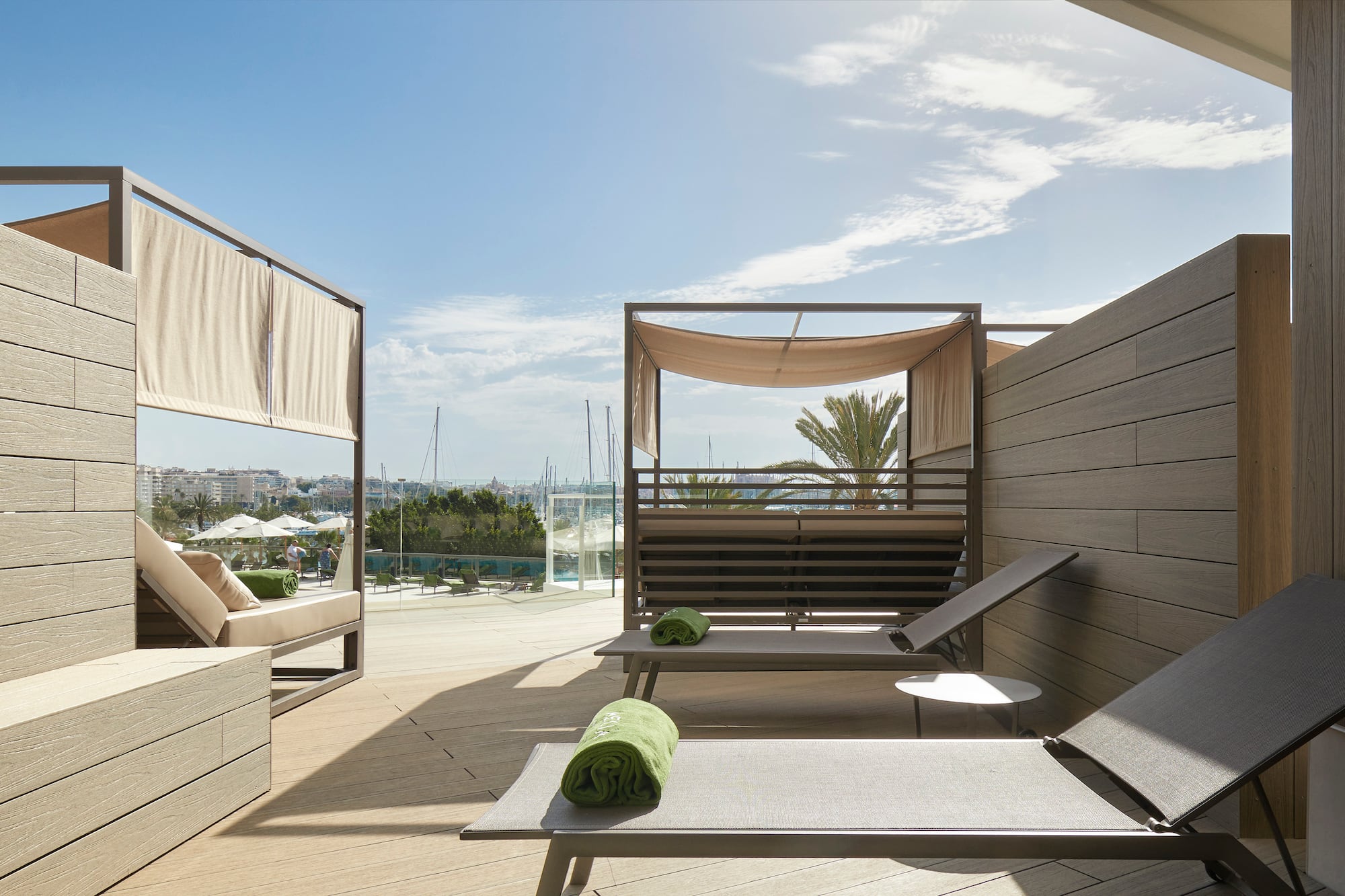 a deck with lounge chairs and a pool
