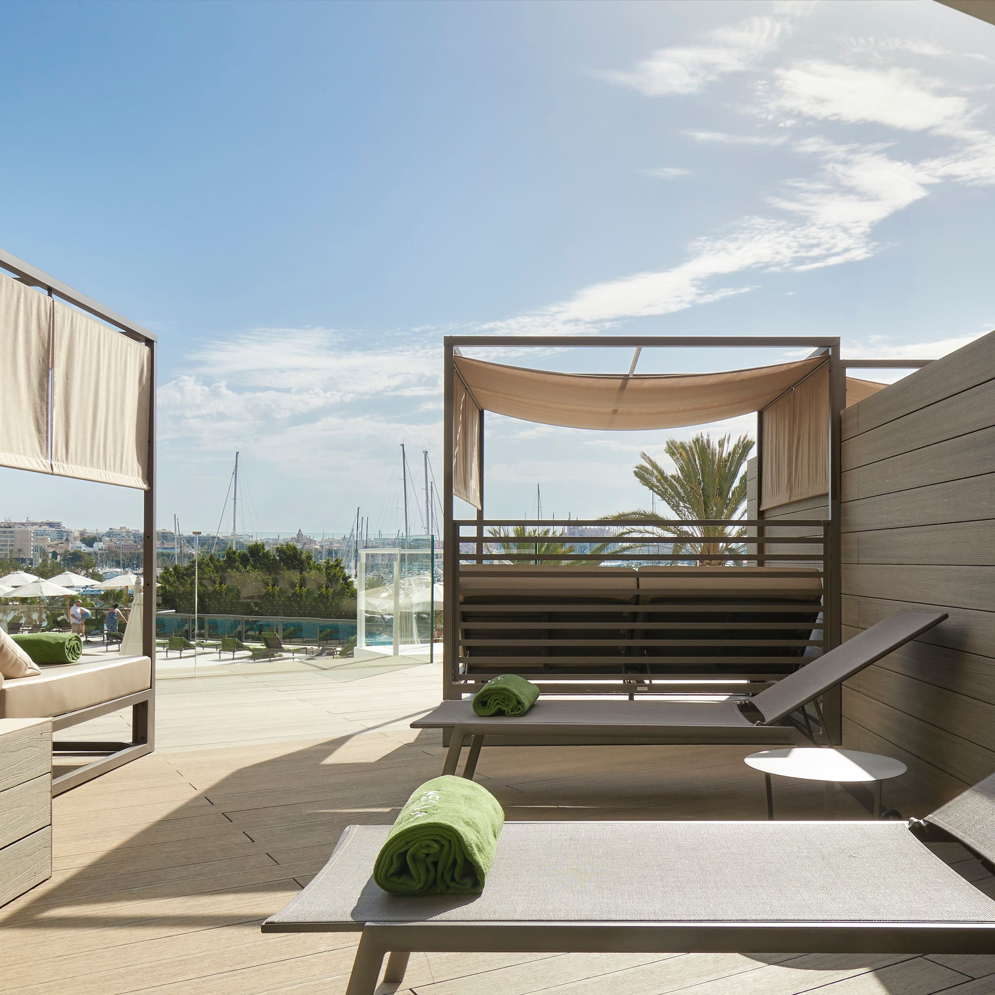 a deck with lounge chairs and a pool