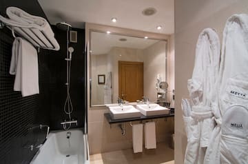 a bathroom with a bathtub and sink
