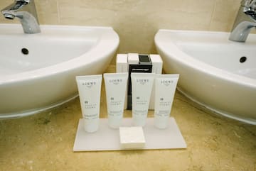 a group of white containers on a white surface