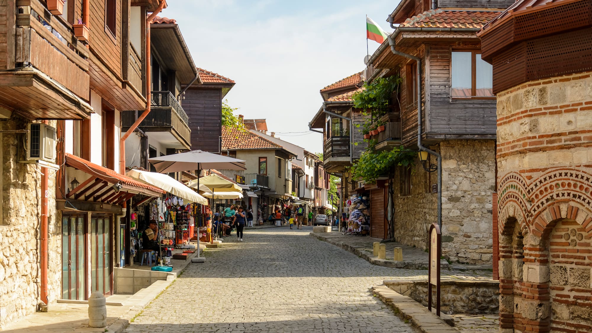 a street with buildings and shops on the side