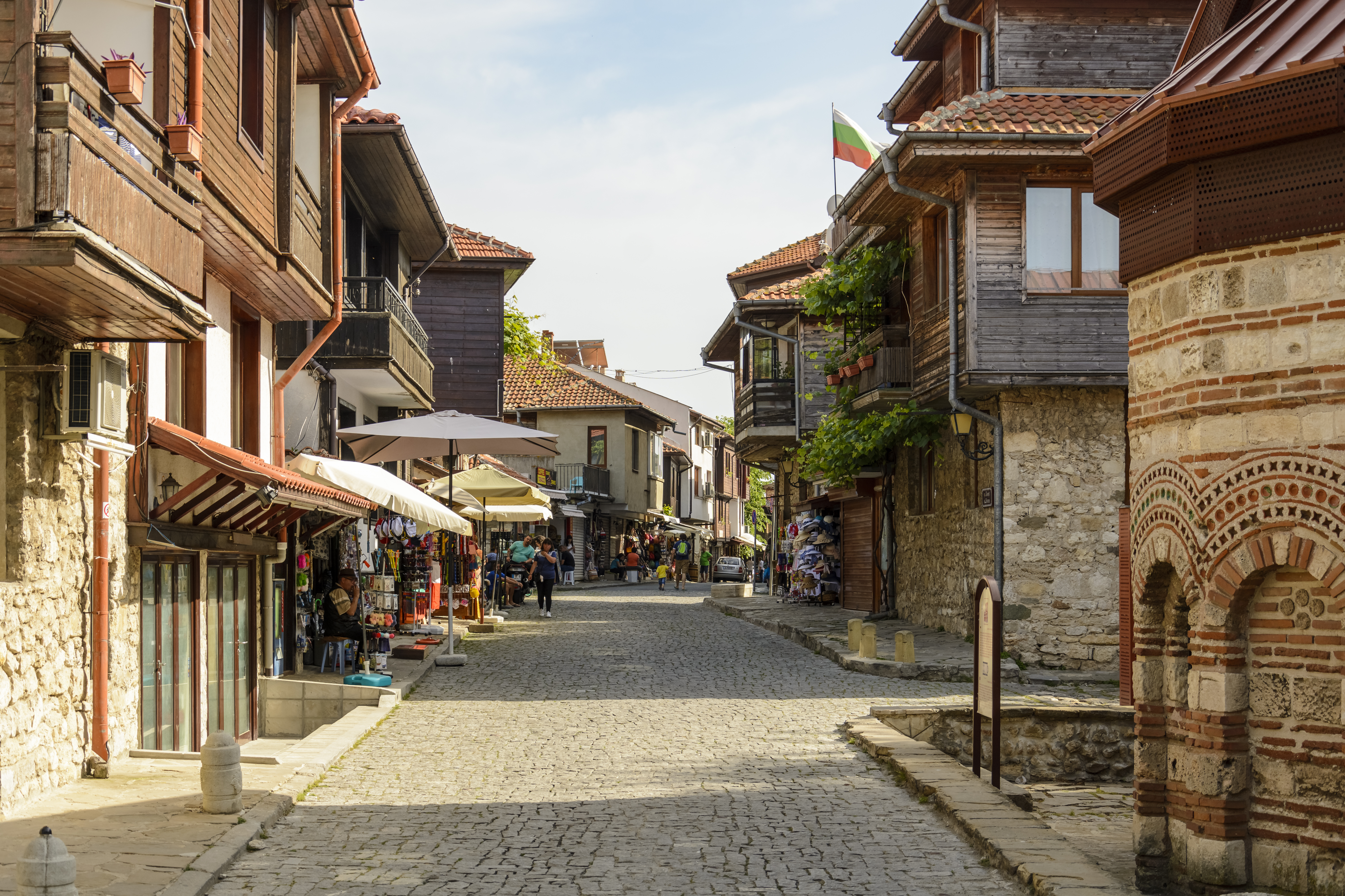 a street with buildings and shops on the side