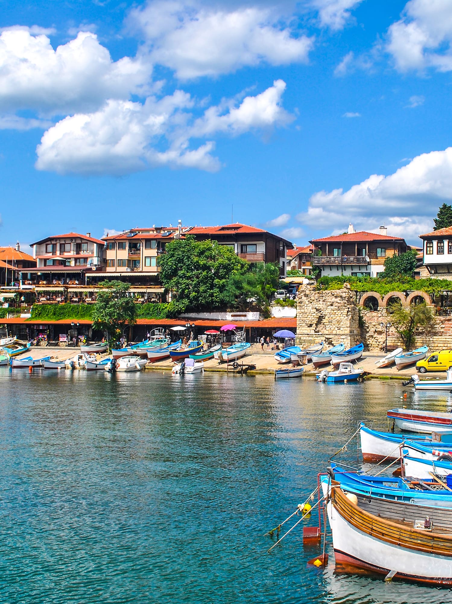 boats on the water by a city