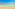 a beach with clear water and blue sky
