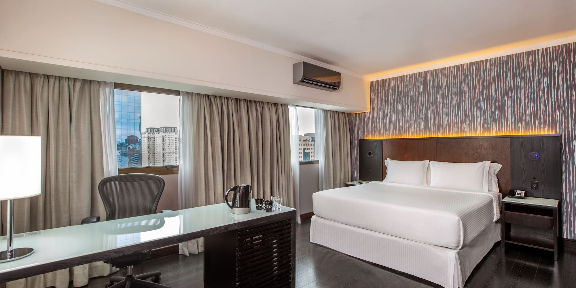 a room with a bed and a desk