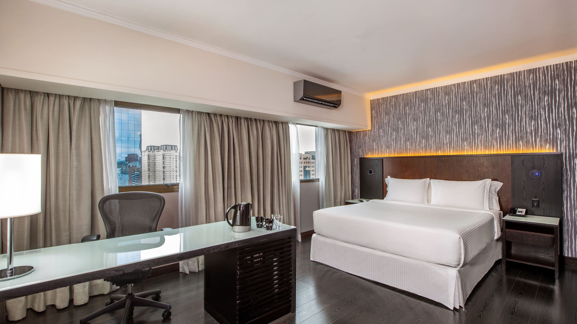 a room with a bed and a desk