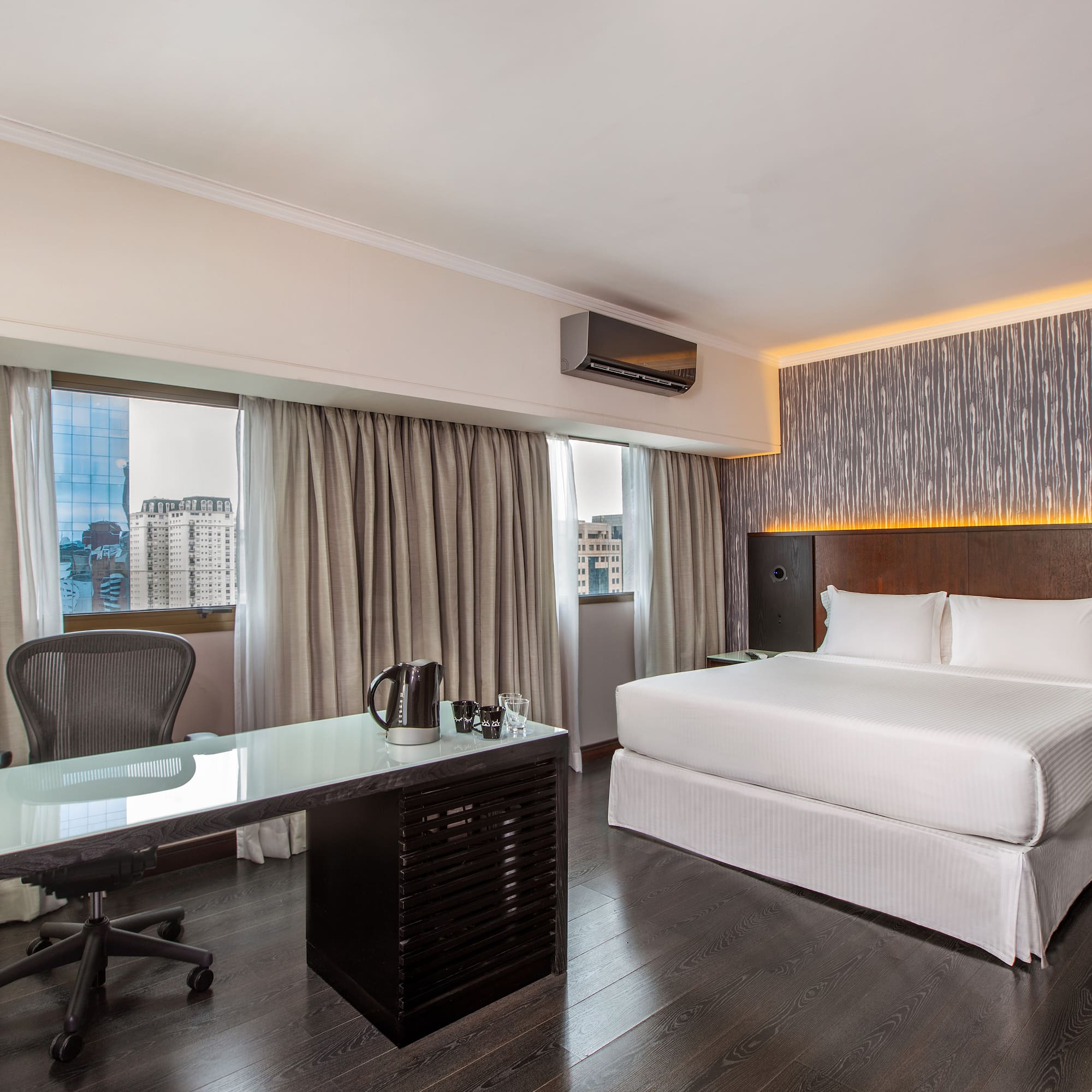 a room with a bed and a desk