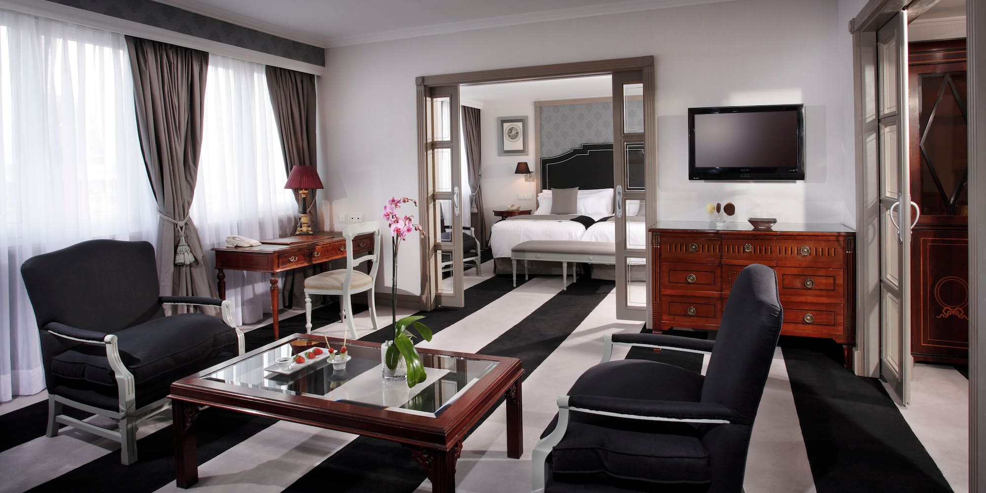 a room with a television and a bed