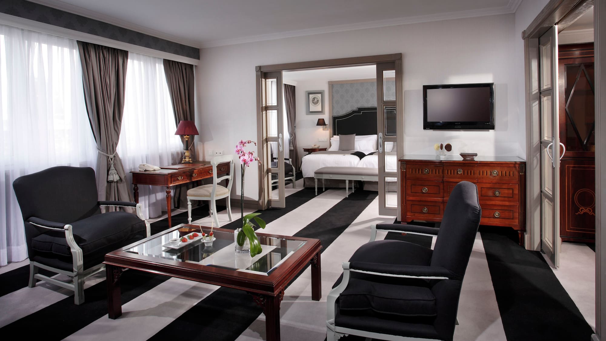 a room with a television and a bed