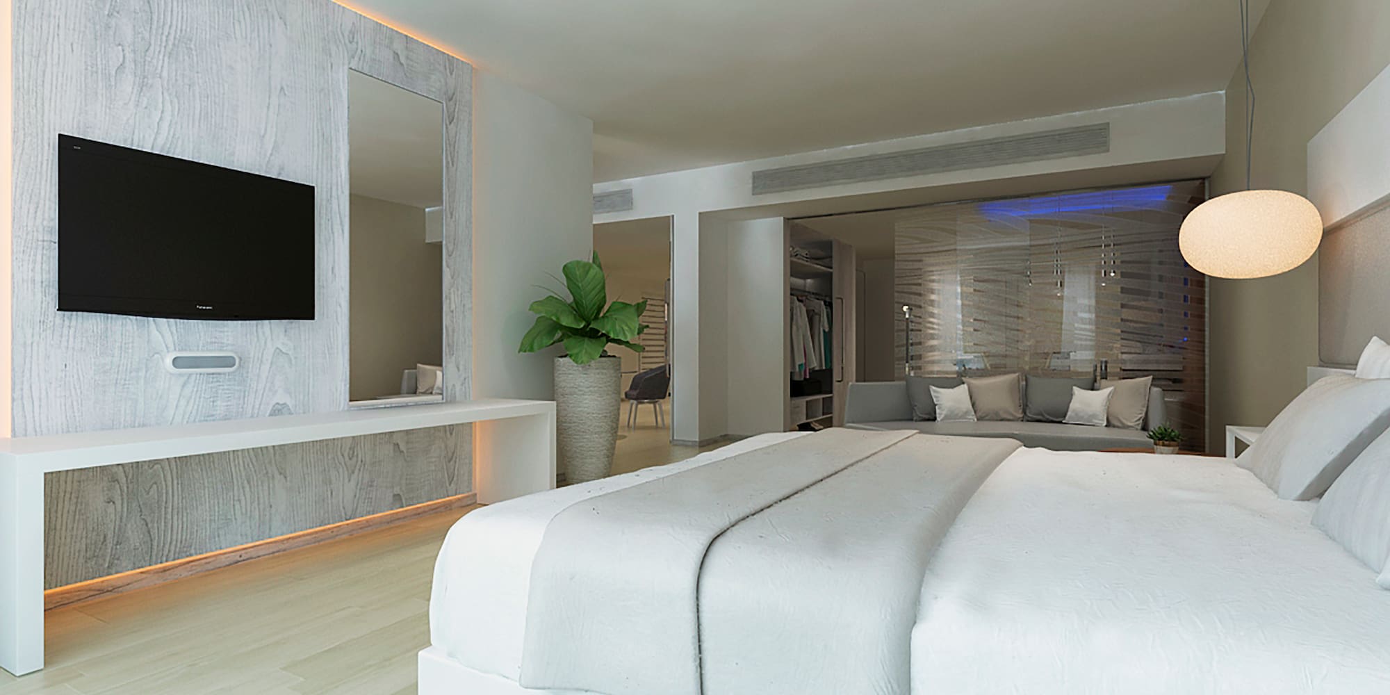 a room with a large bed and a television