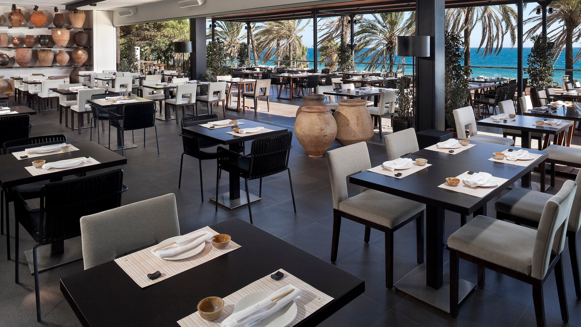 a restaurant with tables and chairs