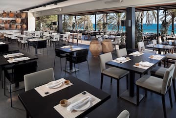 a restaurant with tables and chairs