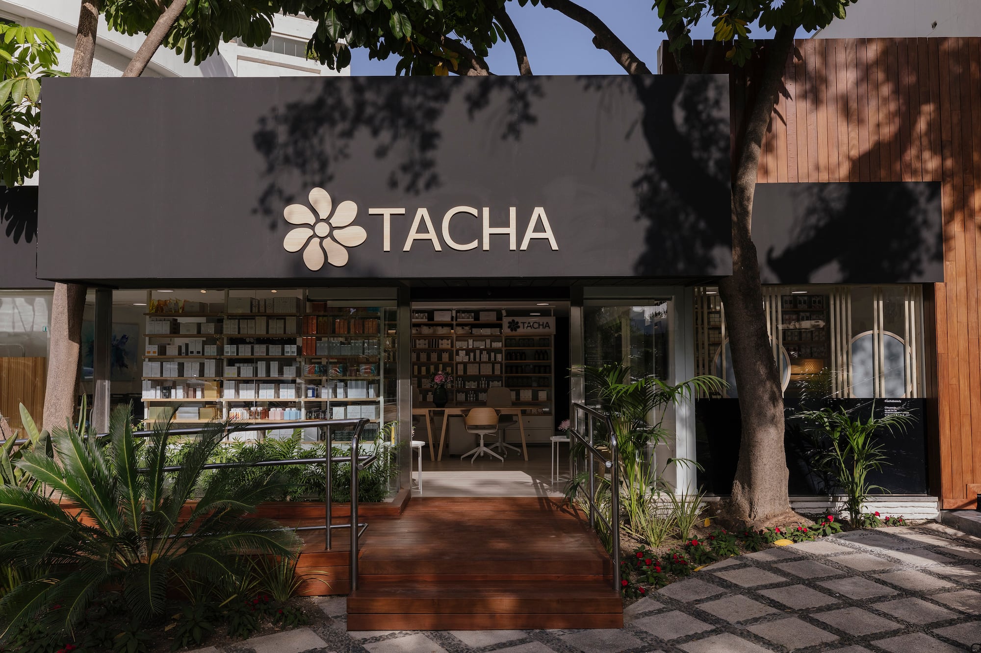 a store front with a sign and a bookcase