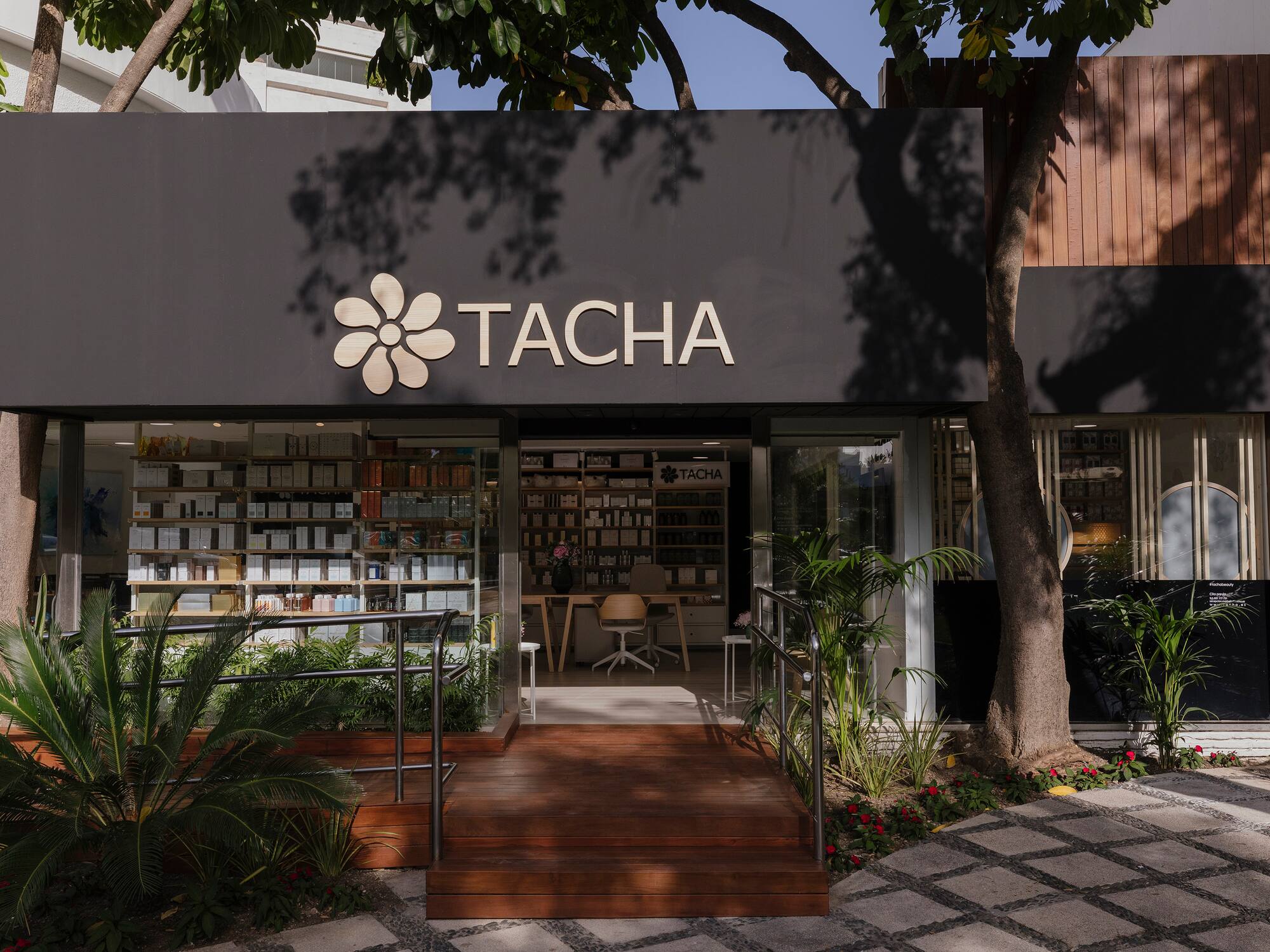 a store front with a sign and a bookcase