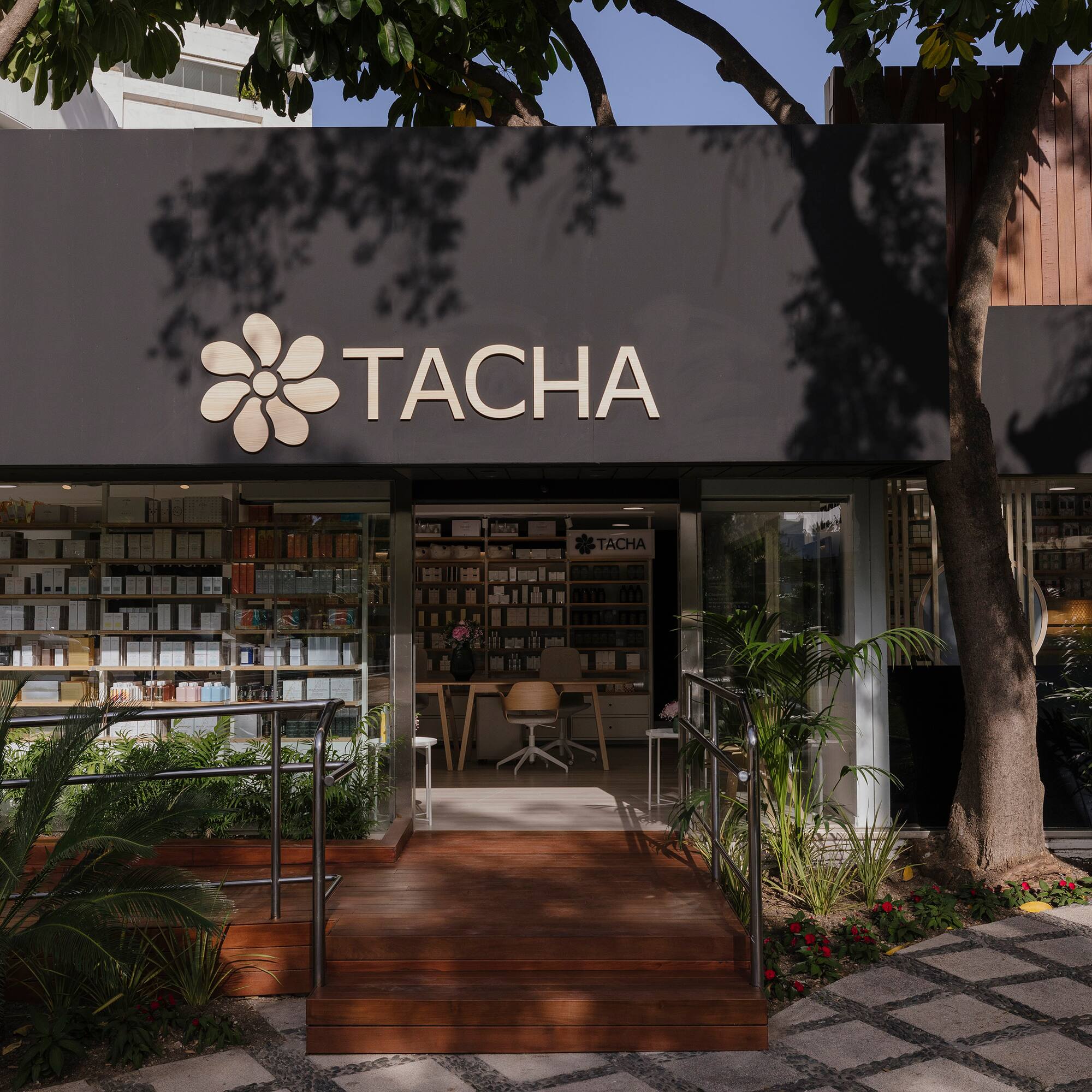 a store front with a sign and a bookcase