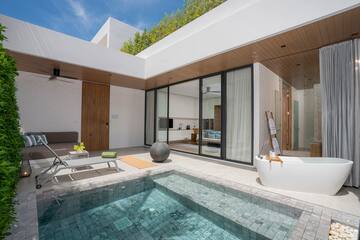 a swimming pool and a tub in a house